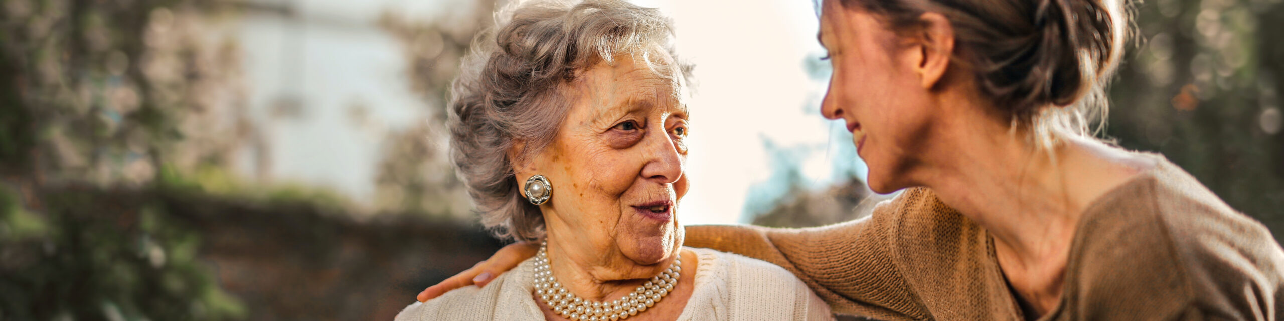 Brain Research Foundation Elderly Woman Smiling at Young Woman